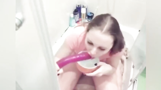 Girl vomits in a cup