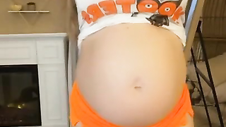 Pregnant changing her clothes